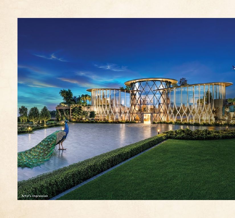 Club Regalia clubhouse exterior at Gaur Alaris, Sector 22-D Yamuna Expressway, lit at dusk